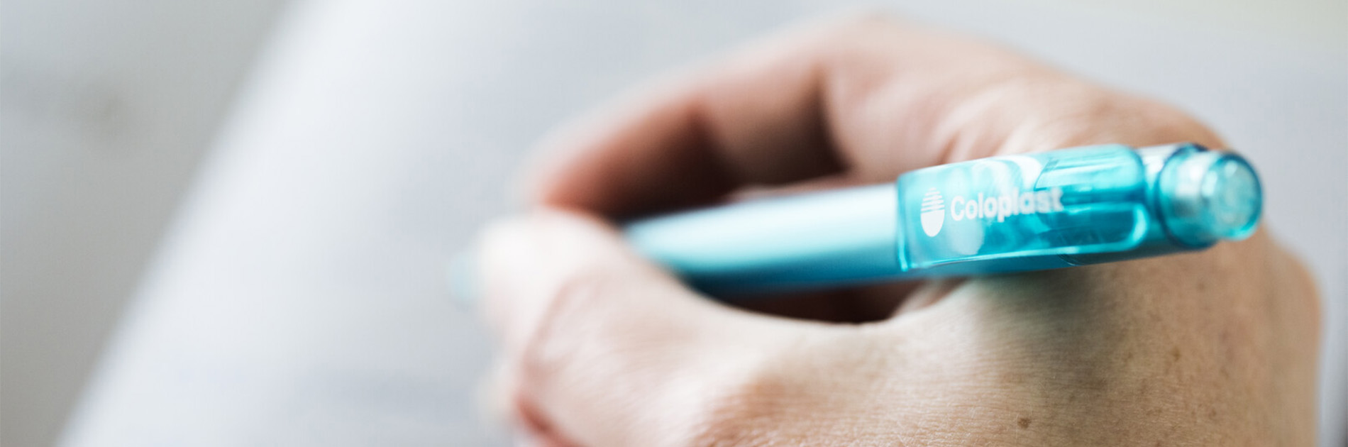 Picture of a man holding a pen